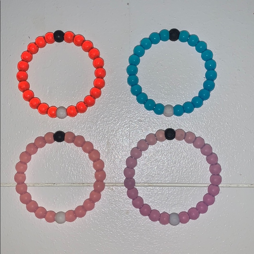 purple, pink, blue and red lokai bracelets